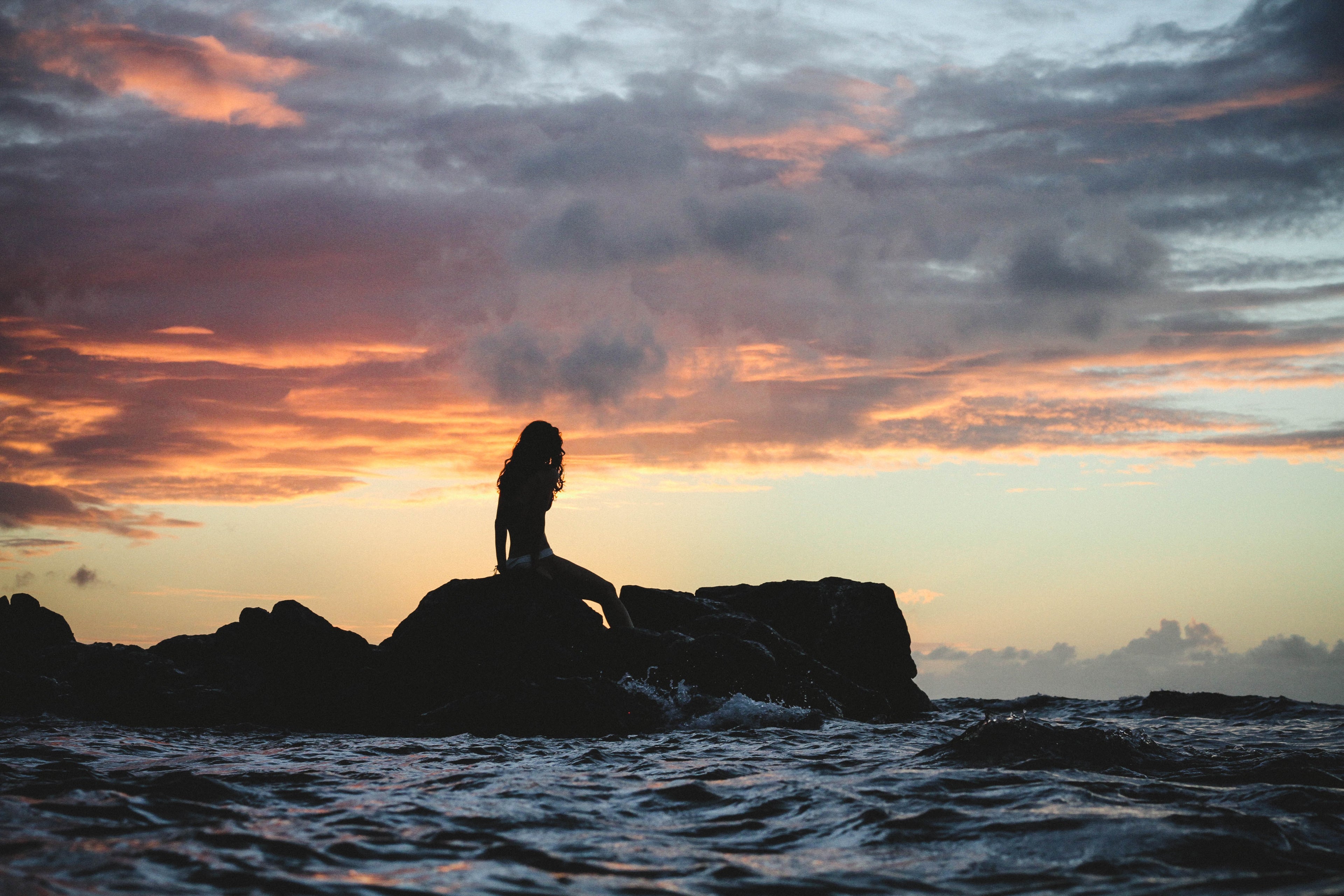 Decorative image of a woman by the sea.